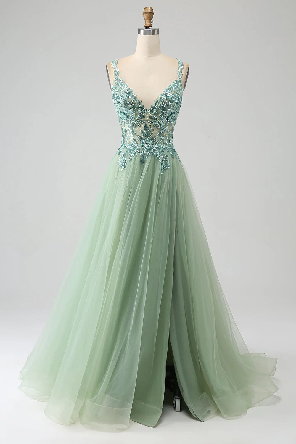 Front view of an elegant light green A-line V-neck long prom dress with delicate appliques.