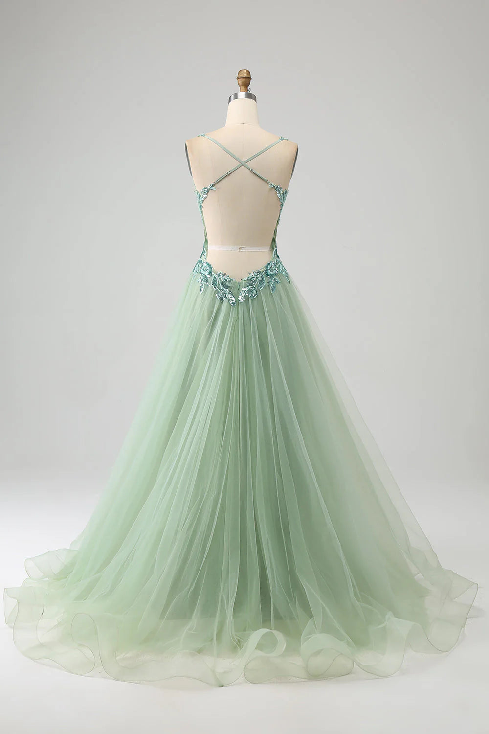 Side view of an elegant light green A-line V-neck long prom dress with delicate appliques.