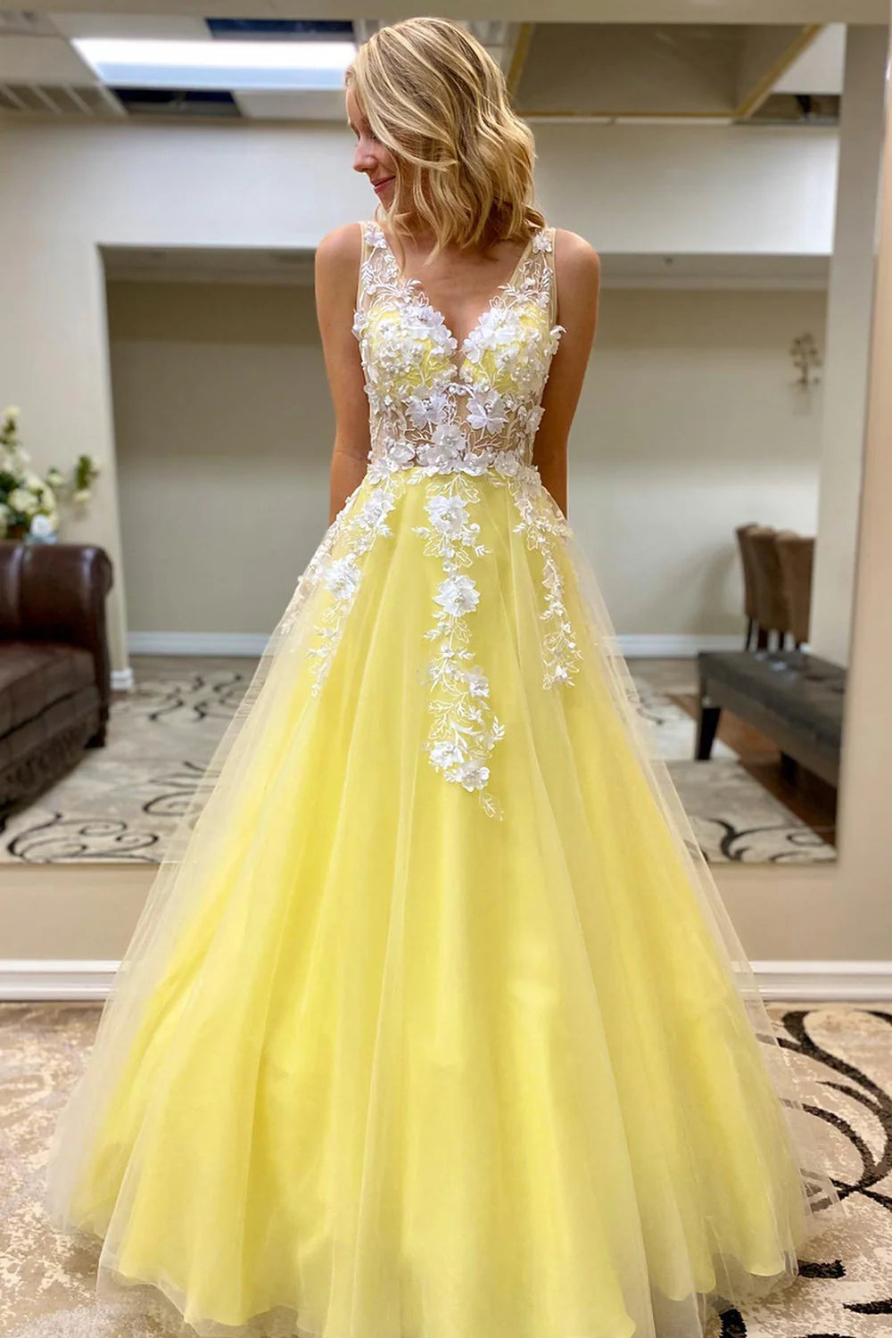 Close-up detail of the appliques on the A-line V-neck long prom dress.