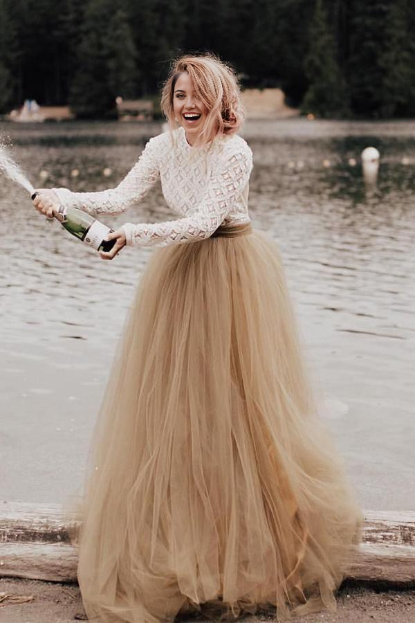 Elegant A-line V-neck long sleeve backless wedding dress.