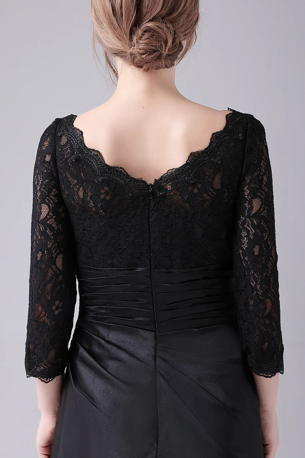 Full length view of the black formal A-line dress.
