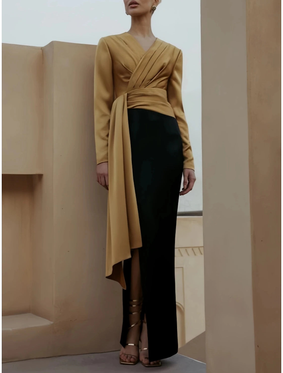 Woman posing in the black A-line satin dress, emphasizing the fabric and silhouette.