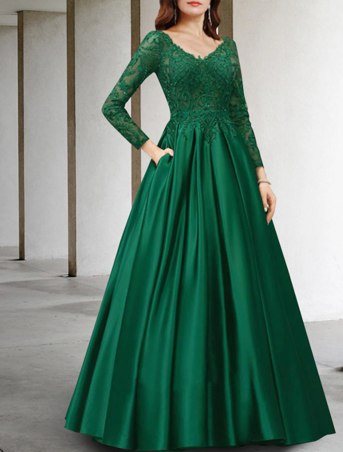 Back view of the luxurious A-Line Mother of the Bride dress with flowing skirt.