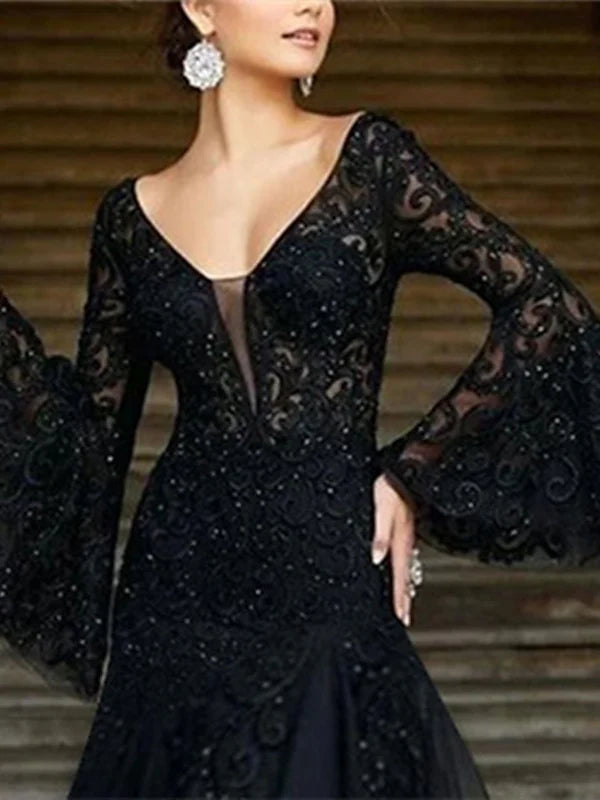 Back view of an A-line V-neck long sleeve floor-length evening dress on a model.