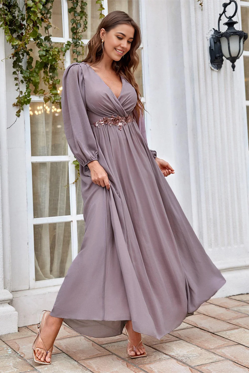 Close-up of the V-neckline and long sleeves on the A-line dress.