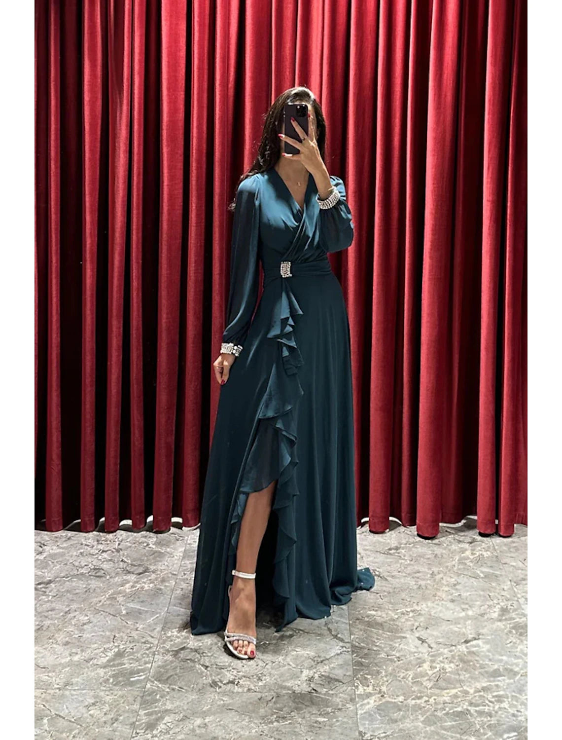 Elegant A-line evening gown with V-neck and long sleeves, featuring a high split.