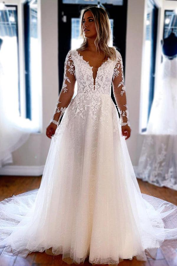 Close-up of the delicate lace detail on a wedding dress sleeve.