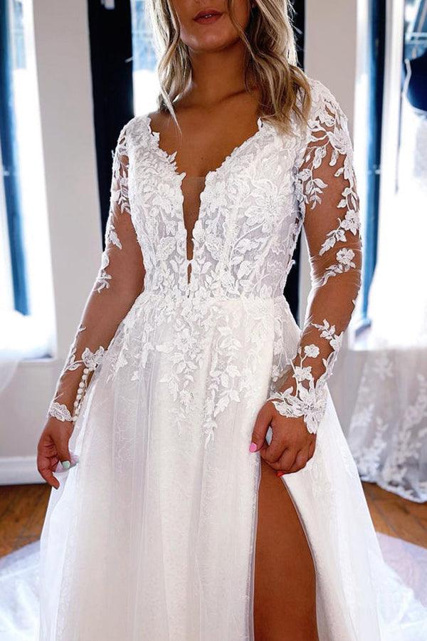 Bride wearing an elegant A-line V-neck lace wedding dress with long sleeves.