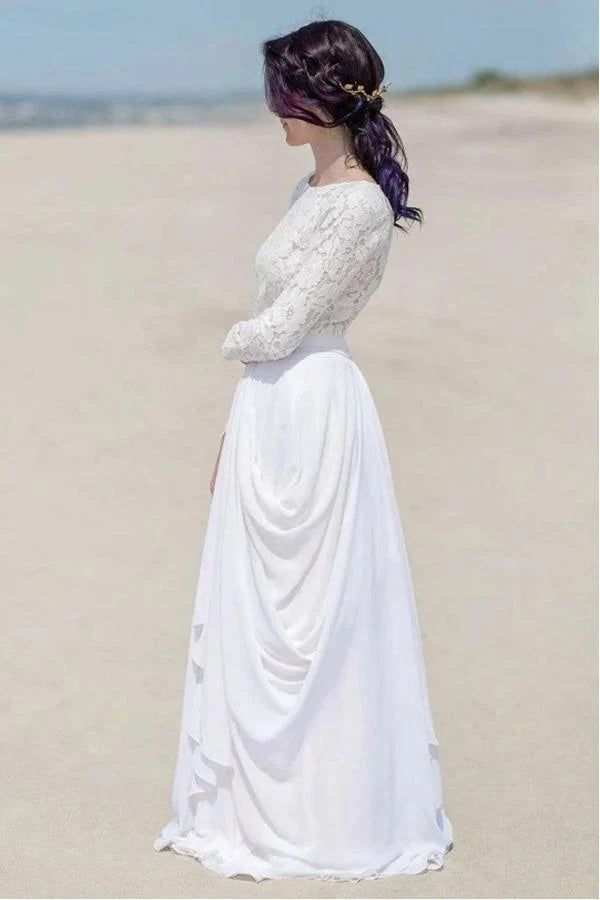 Side profile of a bride wearing a flowing white chiffon wedding dress.