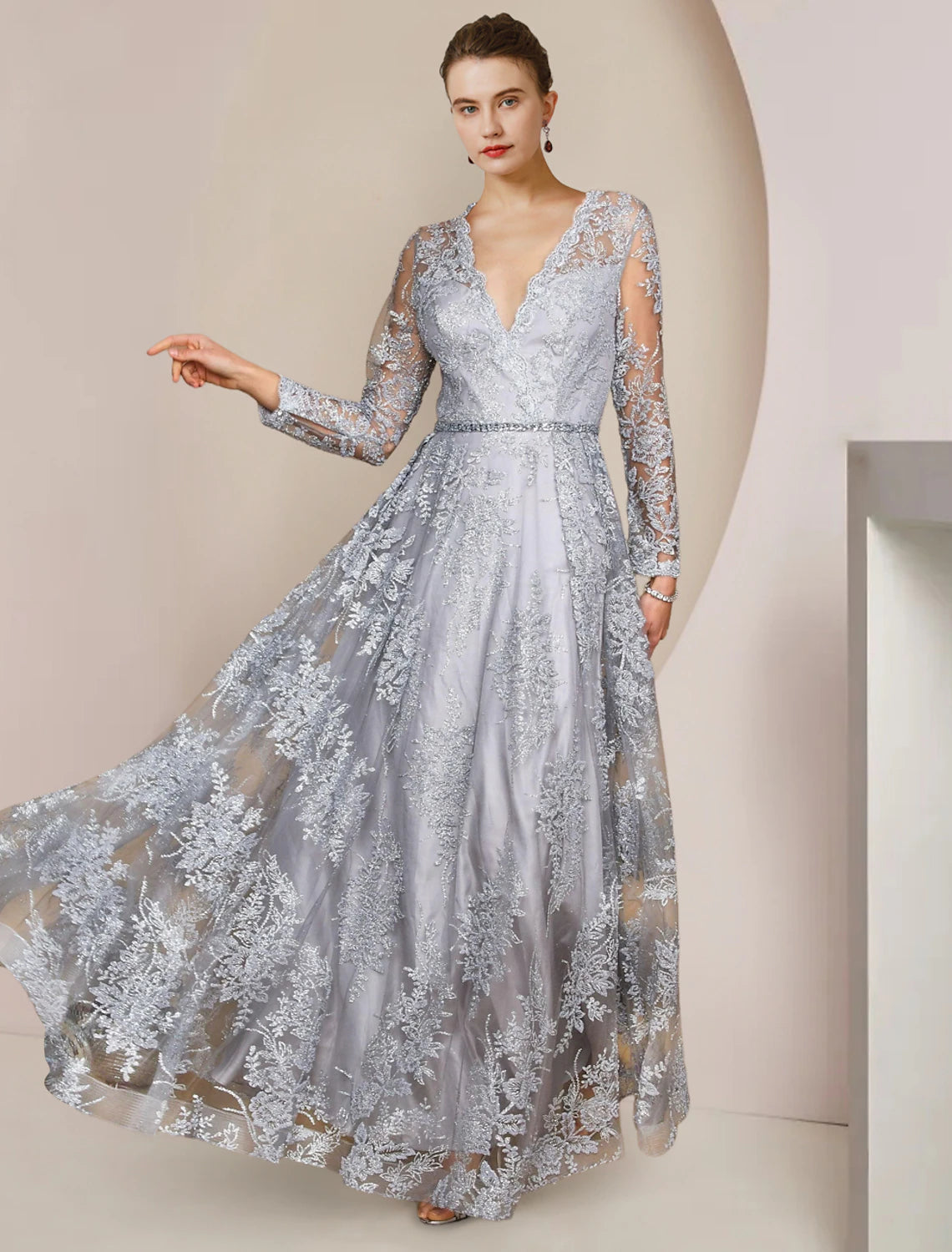 Elegant A-Line Mother of the Bride dress with V-neck, long lace sleeves, appliques, and crystal brooch.