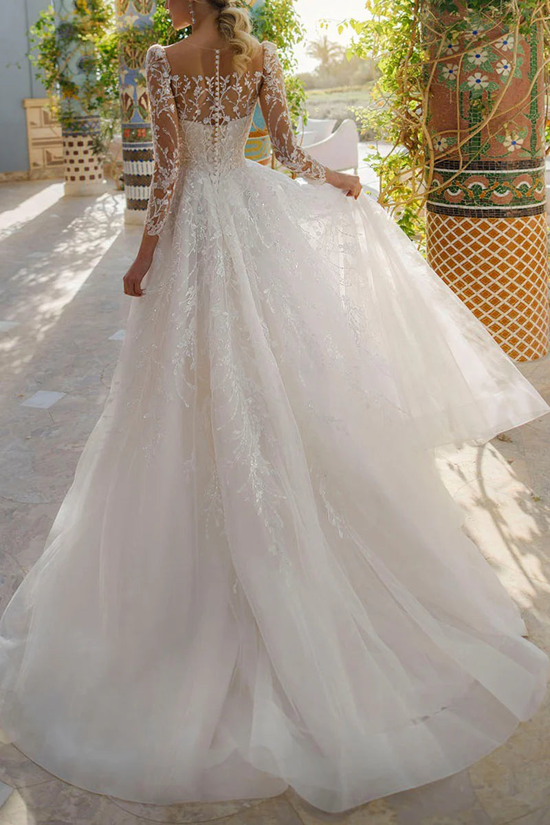 Elegant A-line V-neck long sleeve lace wedding dress, front view.