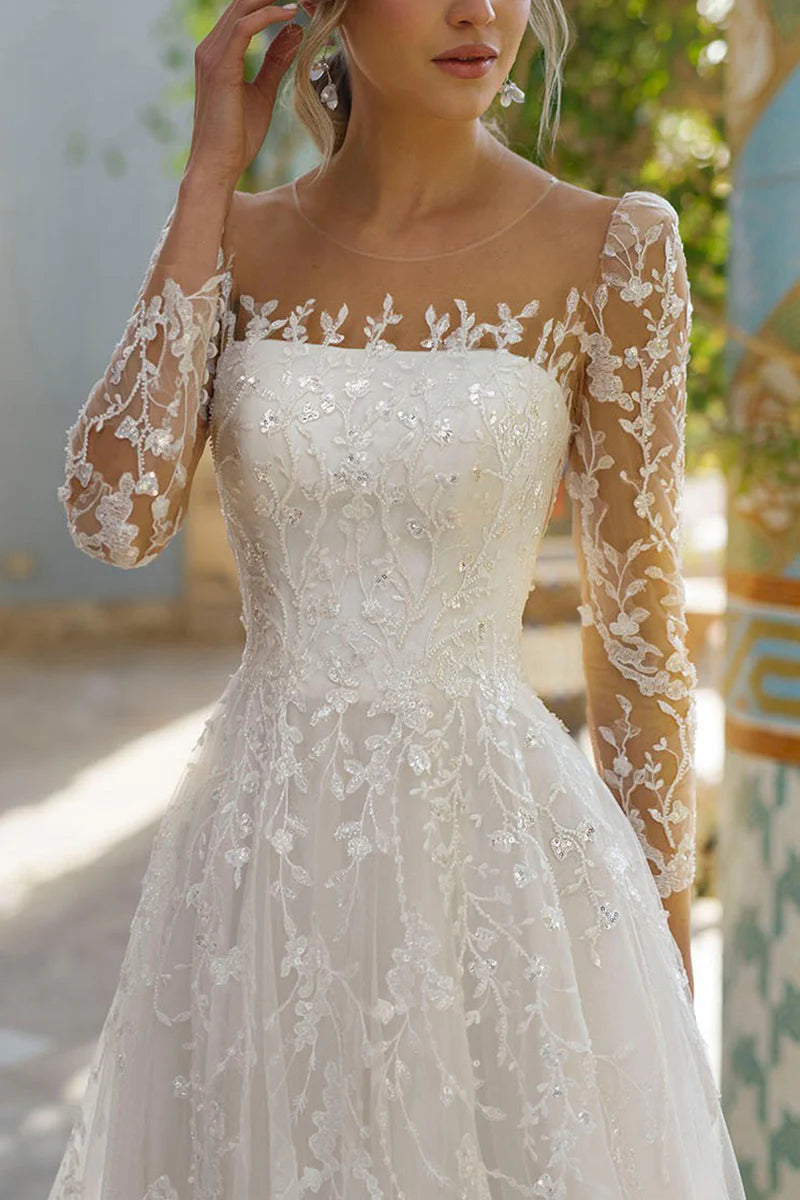 Back view of the A-line lace wedding dress with long sleeves.