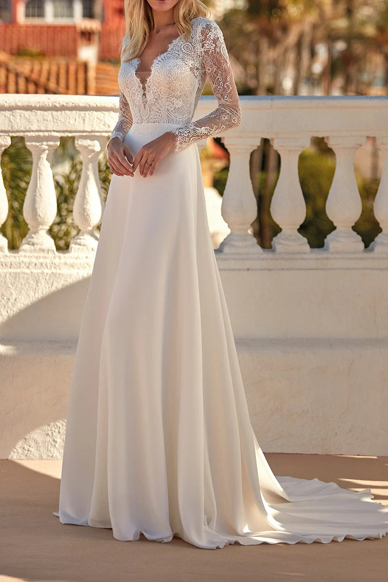 Elegant A-line V-neck long sleeve lace wedding dress.