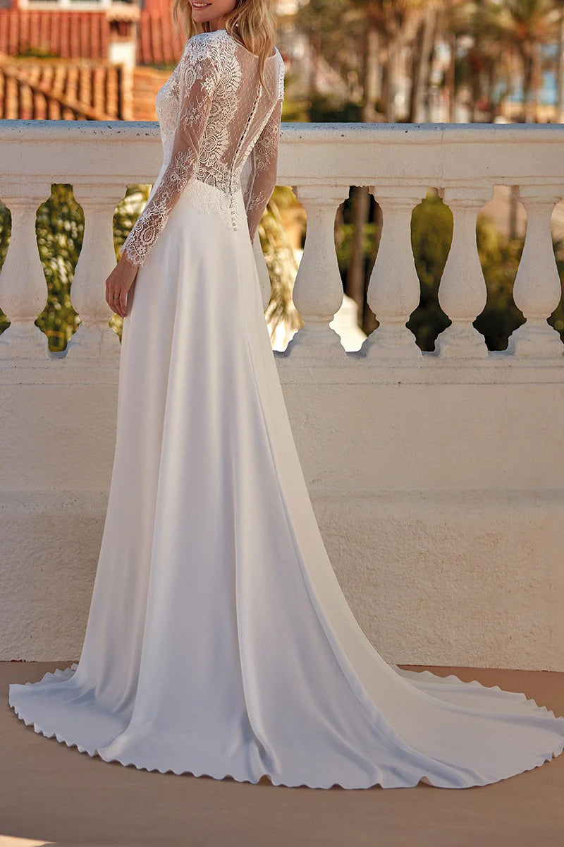 Back view of an A-line V-neck long sleeve lace wedding dress.