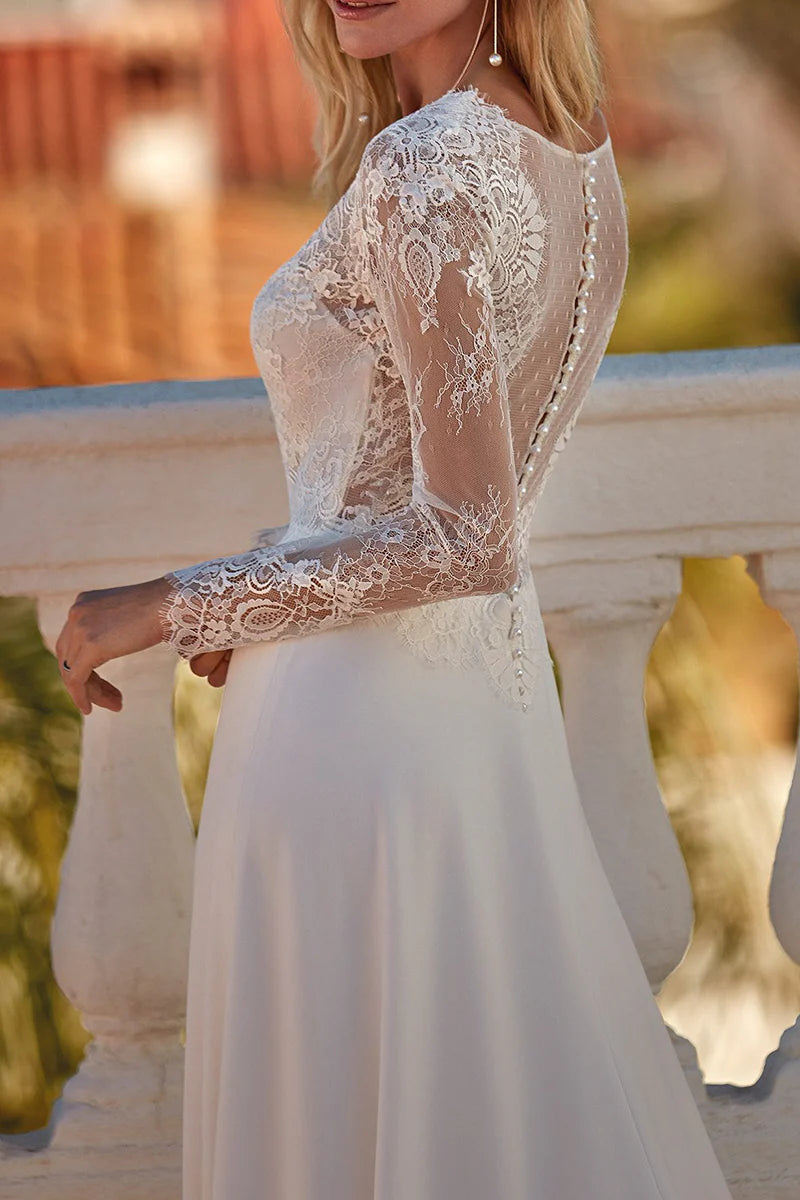 Side view of an A-line V-neck long sleeve lace wedding dress.