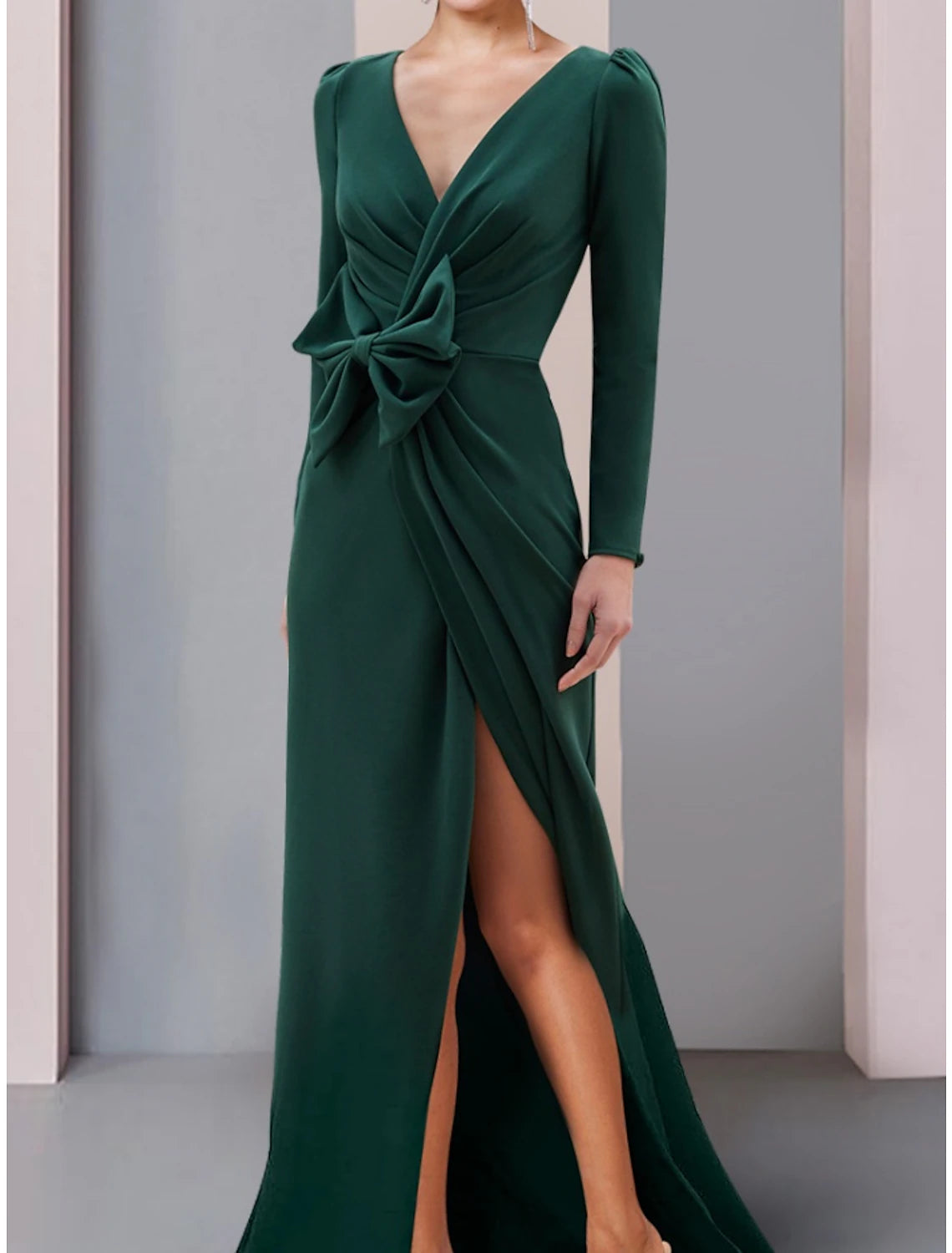 Side view of A-Line formal gown showing split front, ruching, and bow detail.