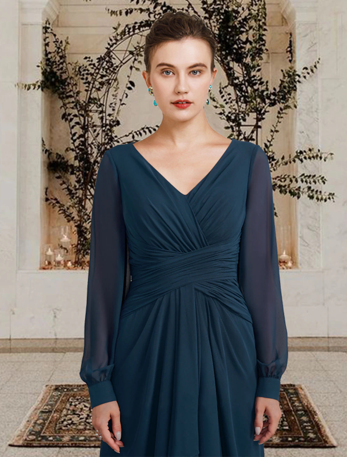 Back view of a floor-length formal gown with long sleeves.