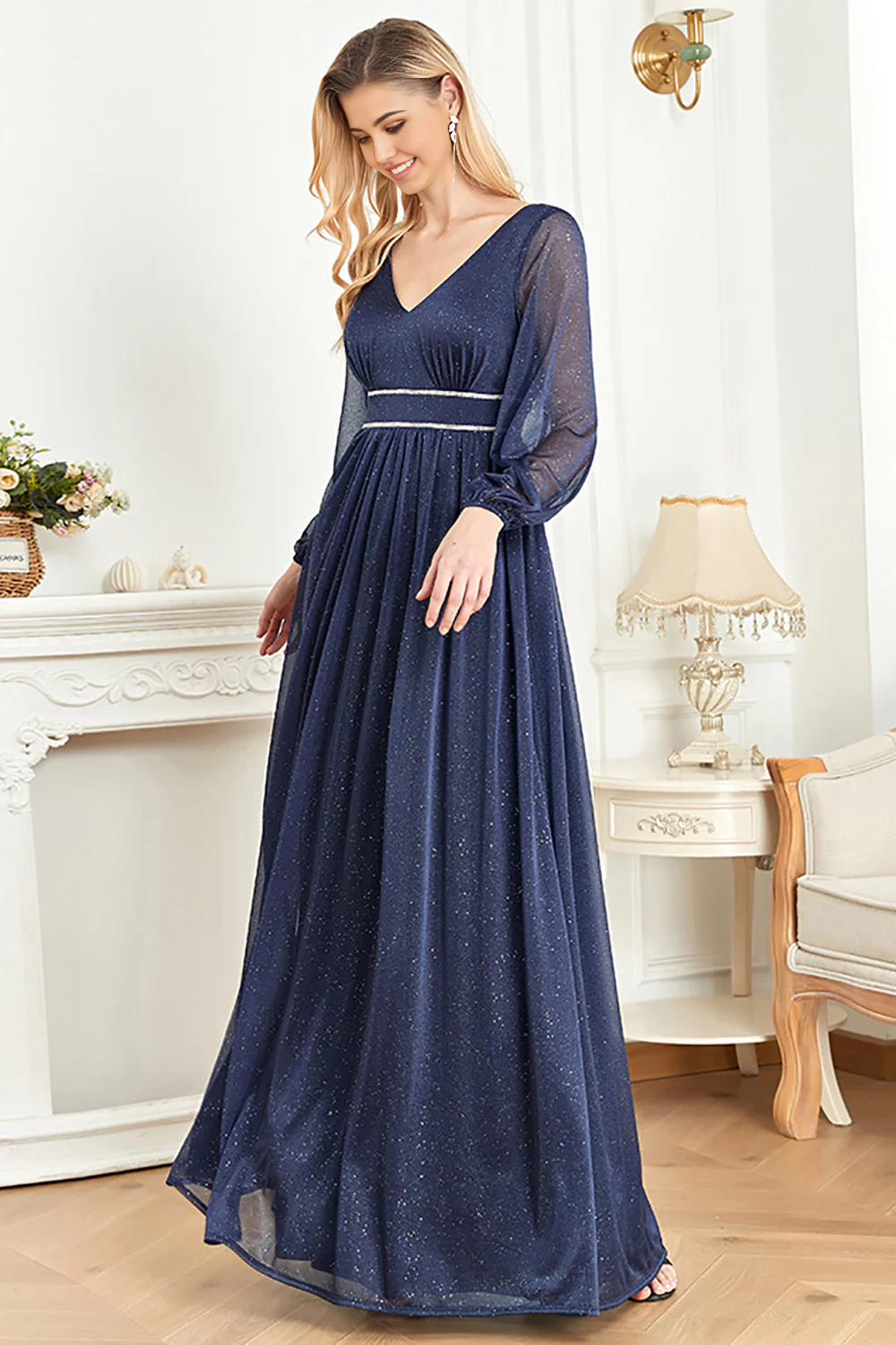 Close-up of the V-neckline and long sleeves of the navy formal dress.