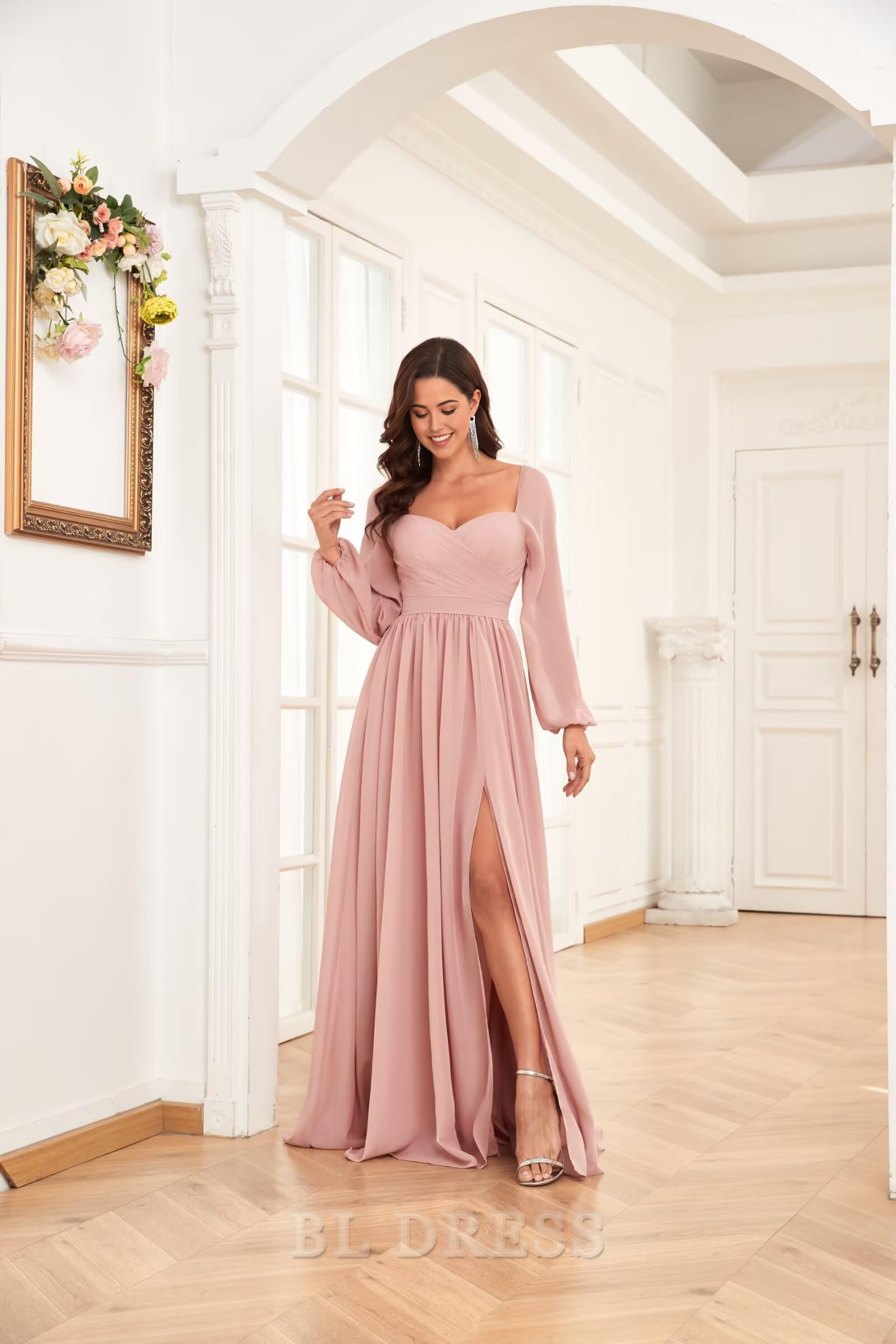 Close-up of the pleated chiffon fabric and long sleeve detail on a formal gown.