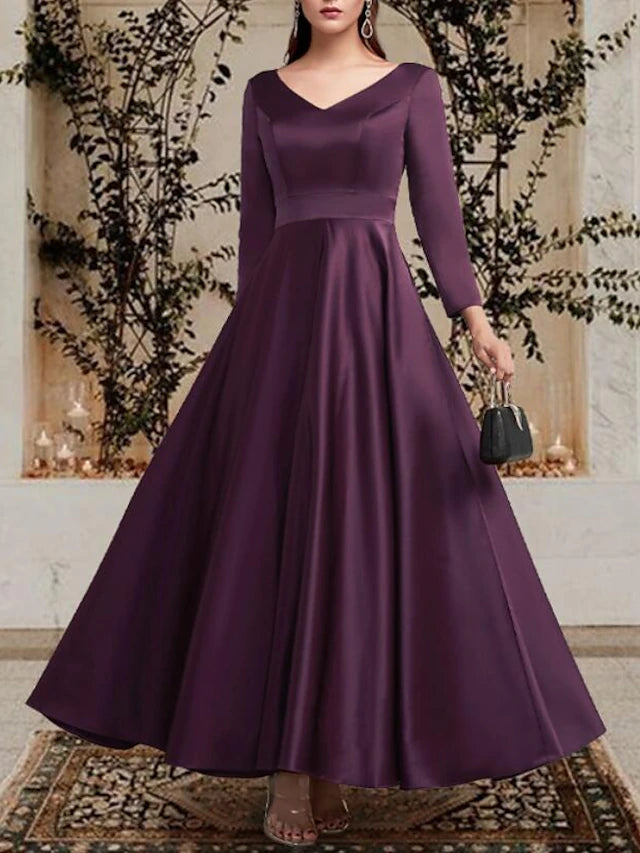 Model posing in the A-line mother of the bride dress, showcasing its flow.
