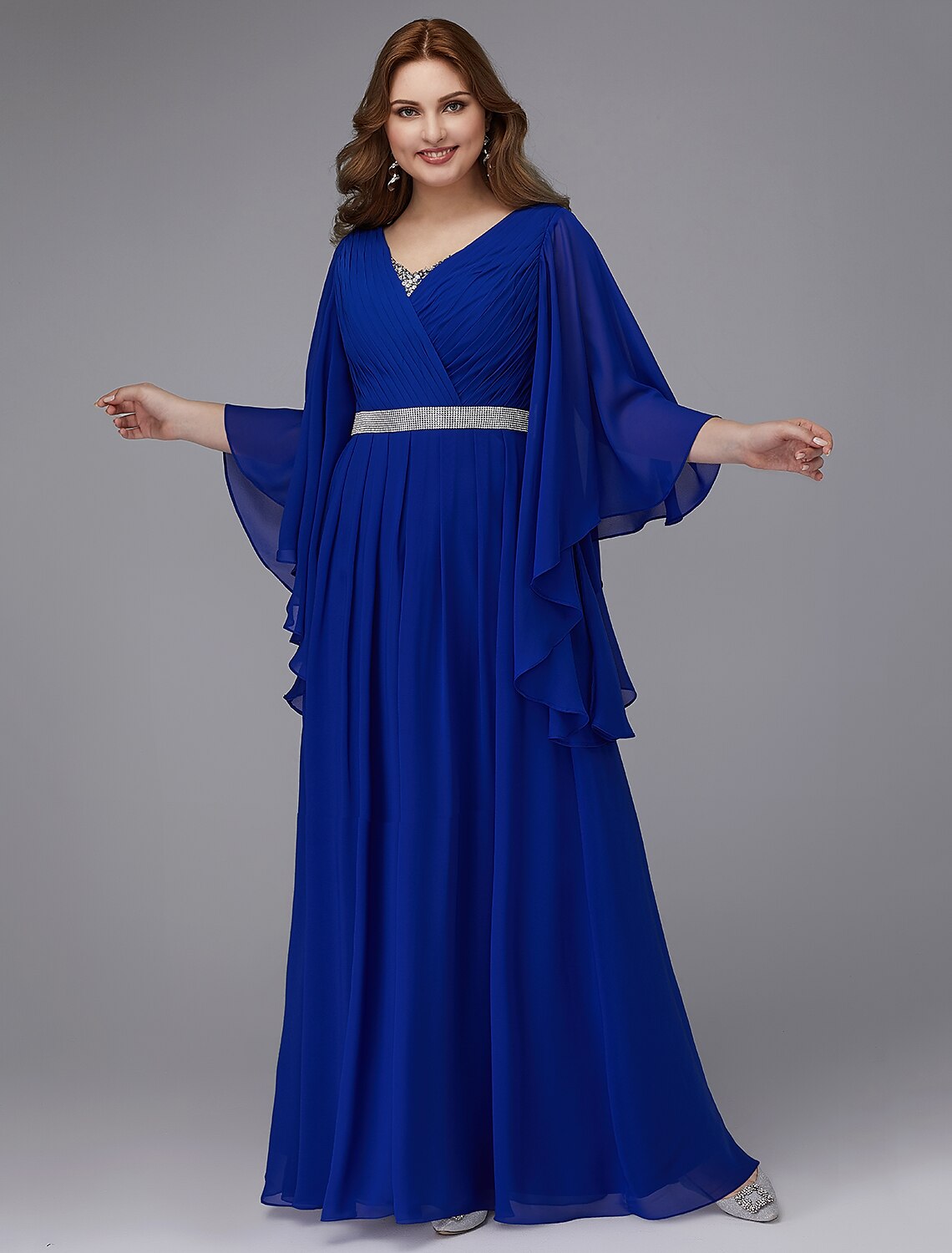 Elegant A-line plus size formal evening gown with long sleeves and V-neck.