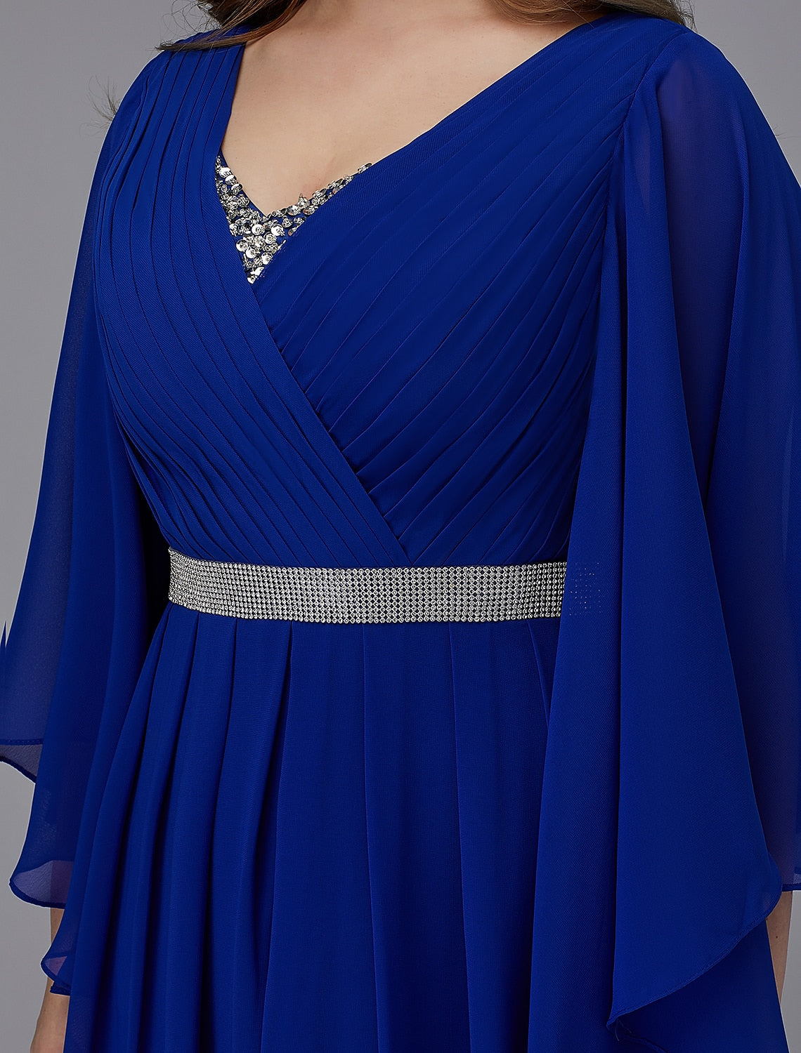 Detail of the sparkling sequin and crystal embellishments on the chiffon fabric.
