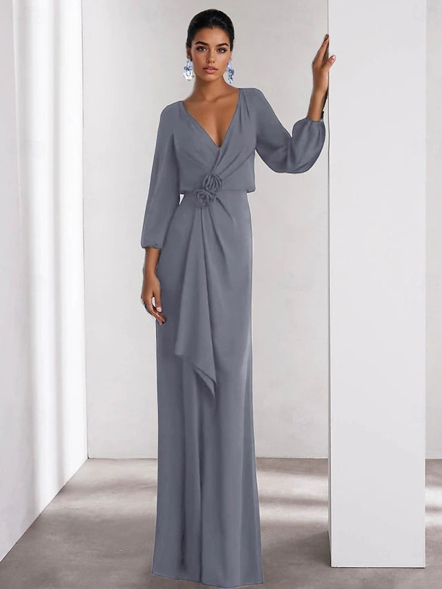 Close-up of the V-neckline and long sleeves on the formal dress.