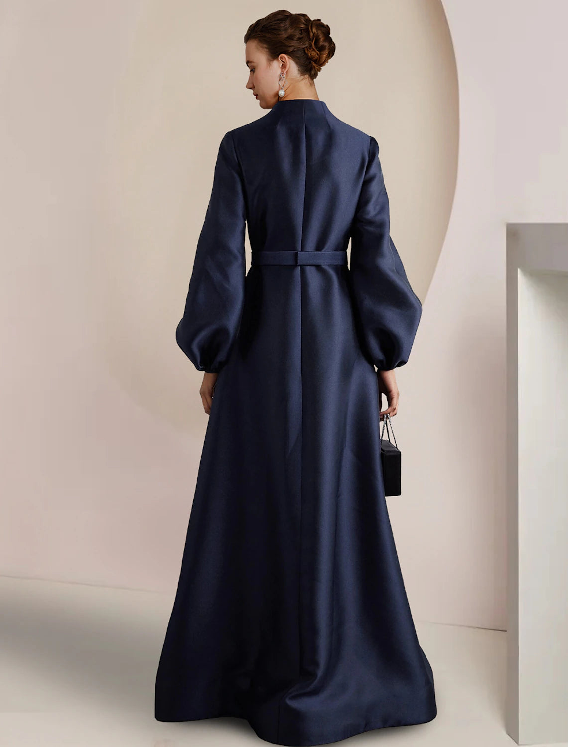 Back view of the floor-length A-line satin dress, showcasing its elegant silhouette.