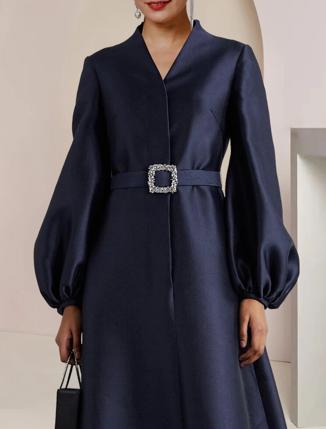 Side view of the long sleeve satin Mother of the Bride dress.