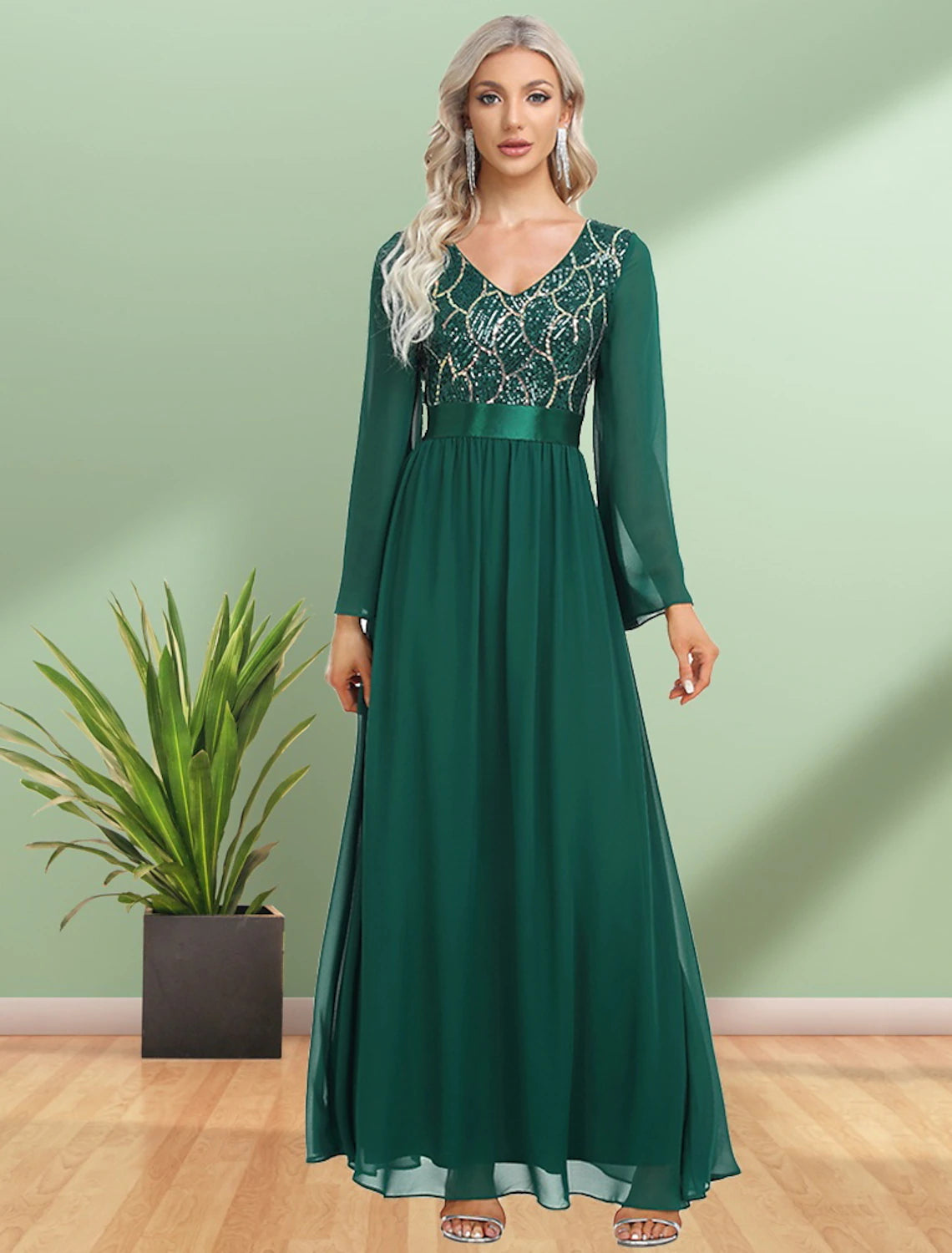 Back view of the floor-length A-line evening gown, showcasing the flowing chiffon skirt and long sleeves.
