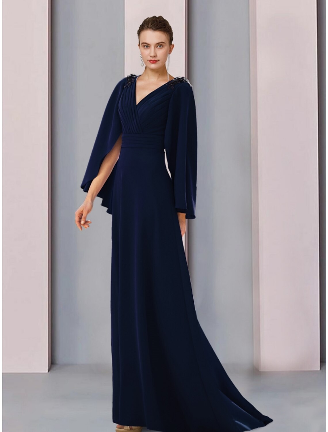 Front view of an elegant A-line Mother of the Bride dress with V-neck, long sleeves, and sequin details.