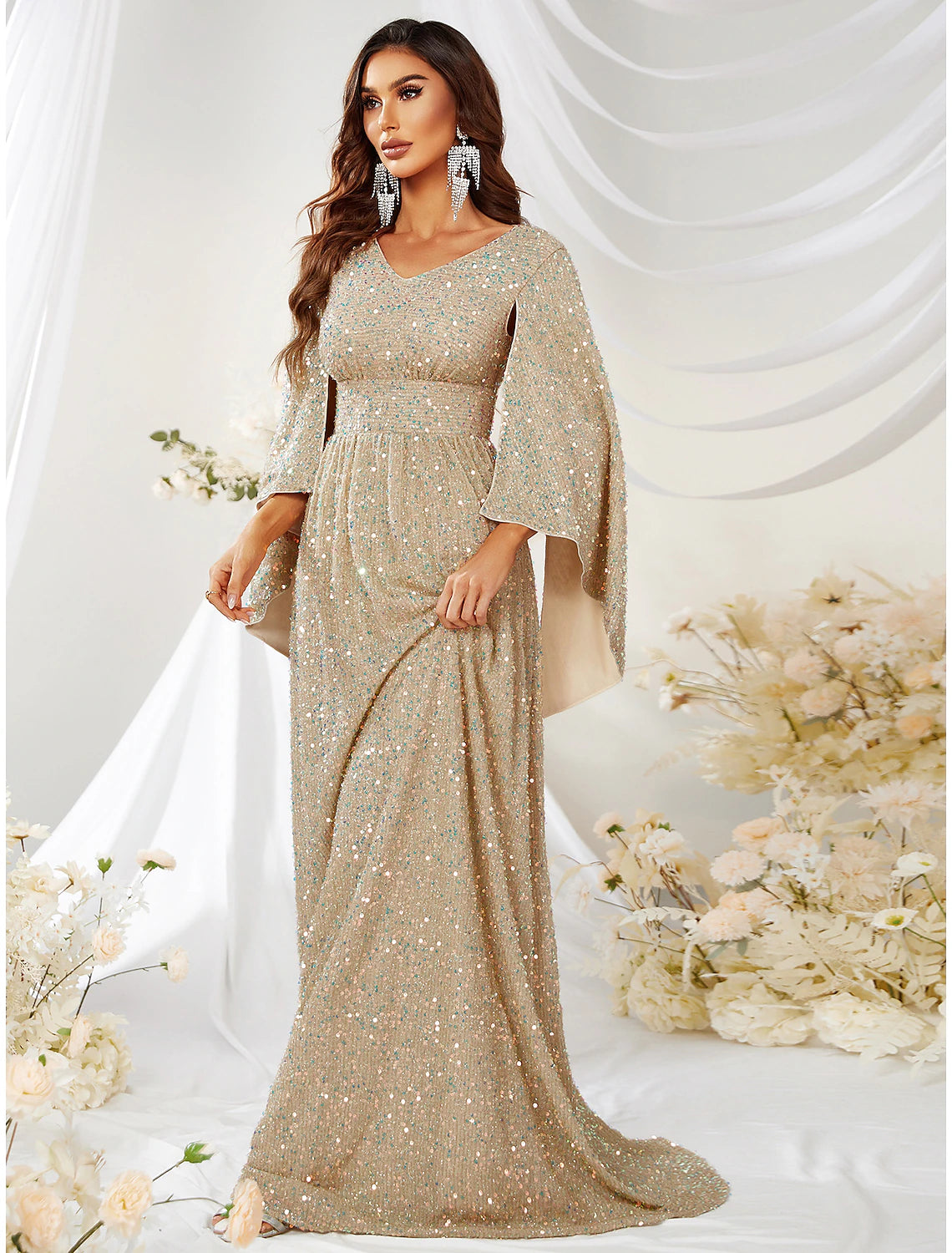 Close-up of the sequin detailing on the V-neck long sleeve evening dress.