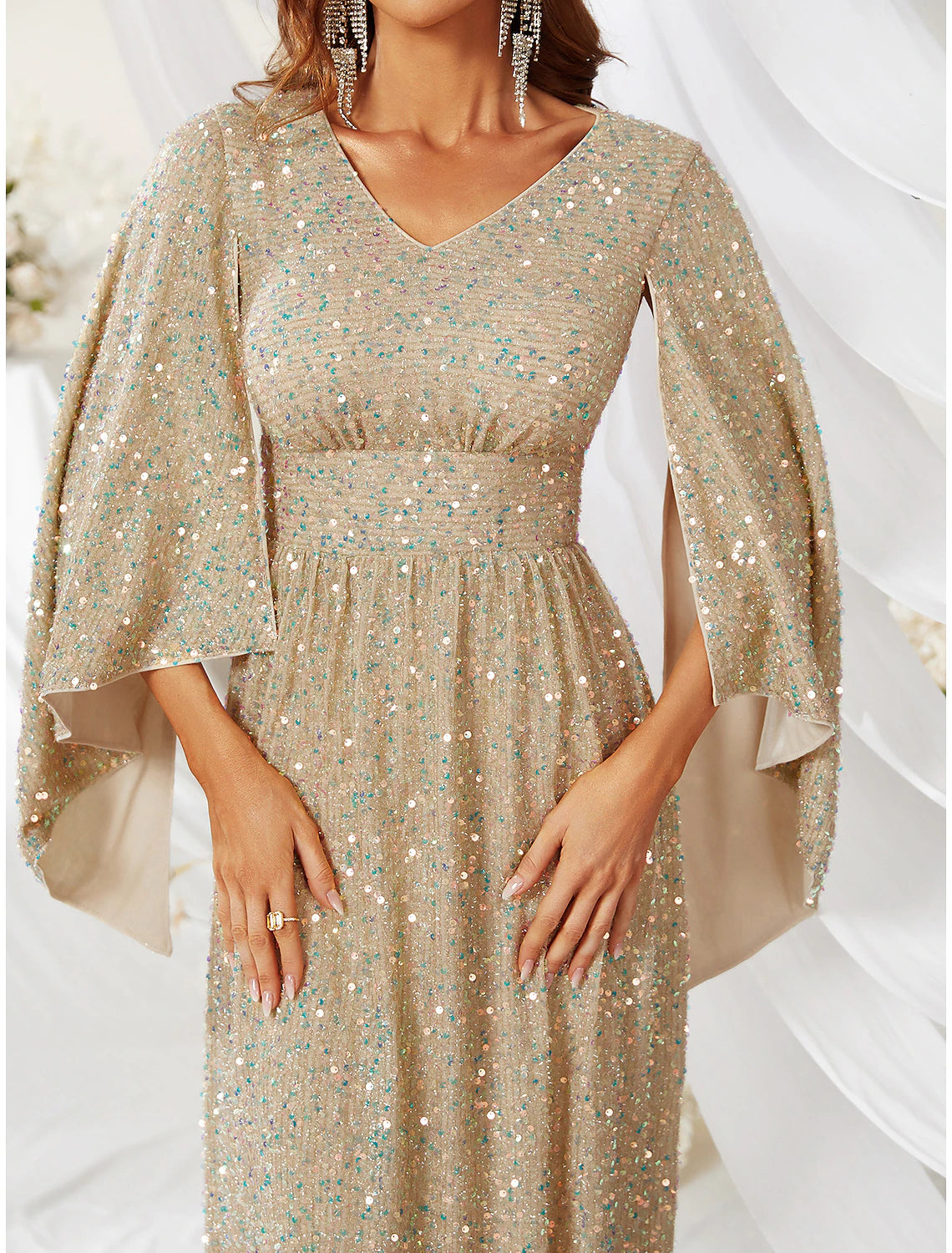 Model wearing the formal A-Line gown with capes and sweep train.
