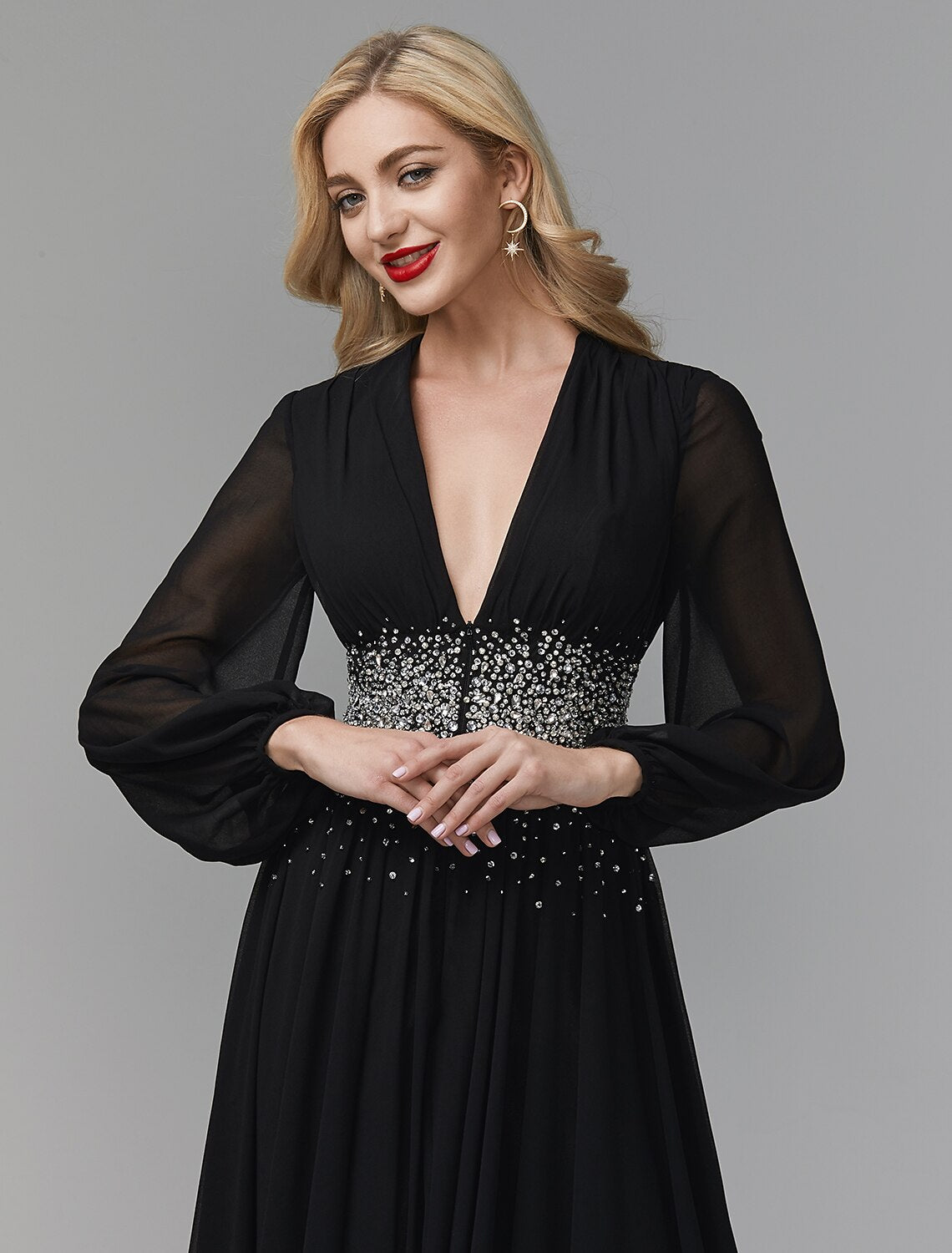 Formal A-line dress with long sleeves and sequin accents.