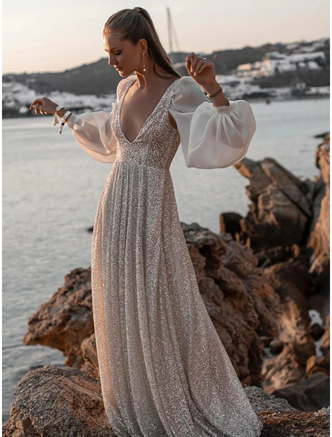 Boho A-line sequined wedding dress with V-neck and long sleeves.