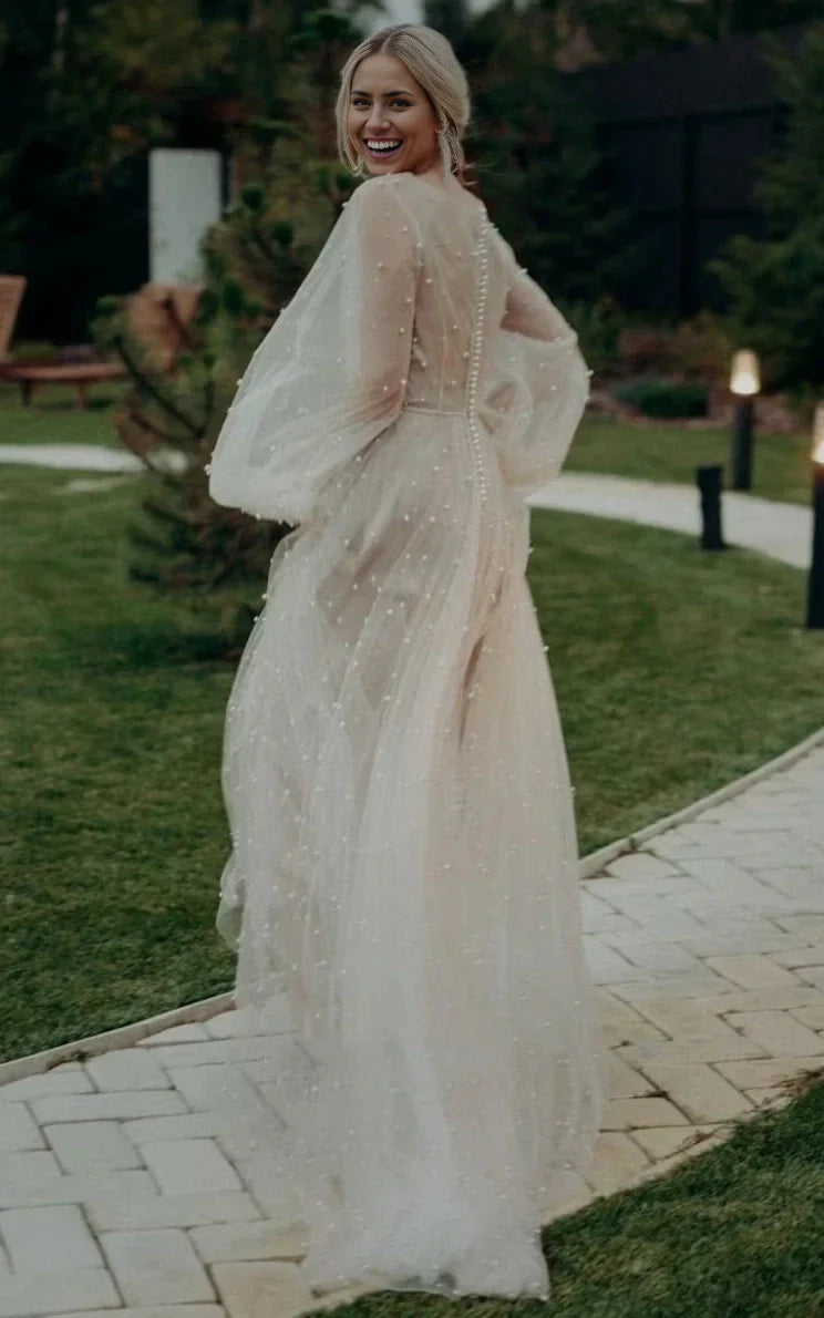 Elegant A-line V-neck long sleeve tulle wedding dress.