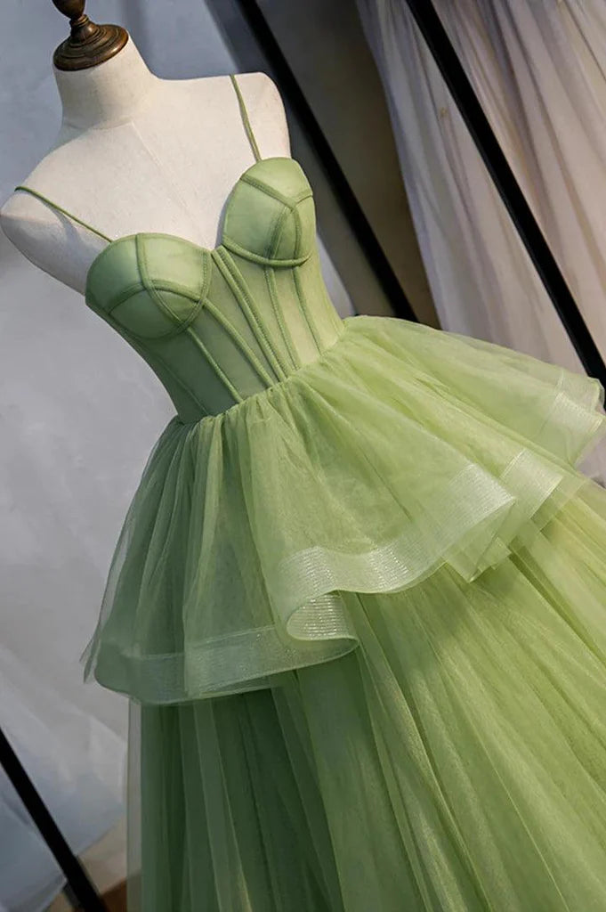 Side view of an A-line V-neck long sleeve tulle prom dress with a dramatic train.