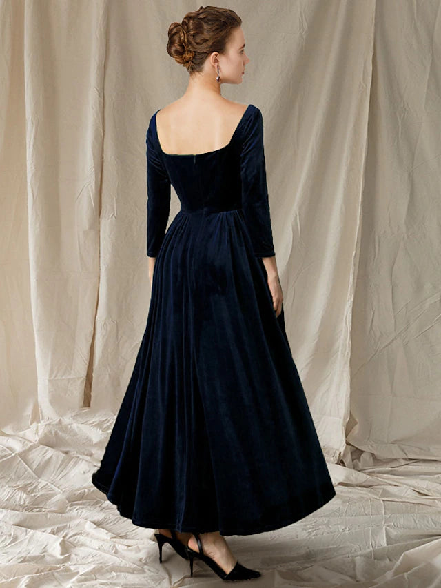 Back view of an A-line velvet dress with long sleeves and pleats, ideal for wedding guests.