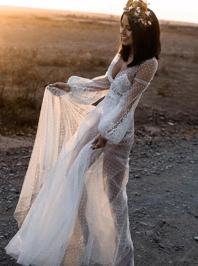 Close-up of appliques on a long sleeves wedding gown.