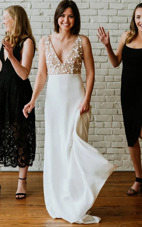 Elegant A-line satin wedding dress with V-neck, low-V back, and delicate appliques.
