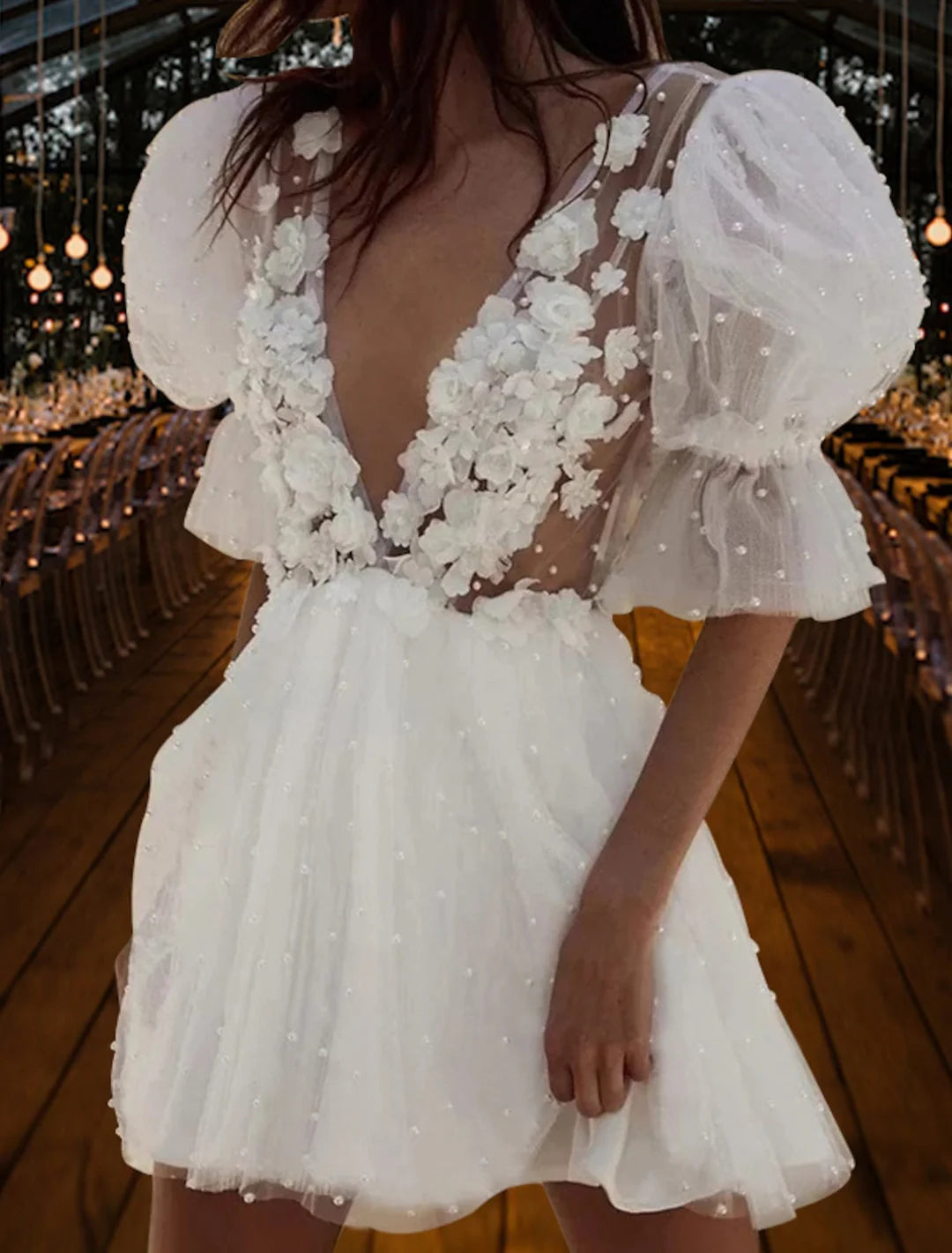 Front view of a model wearing an elegant A-Line V-Neck Mini Lace Wedding Dress.