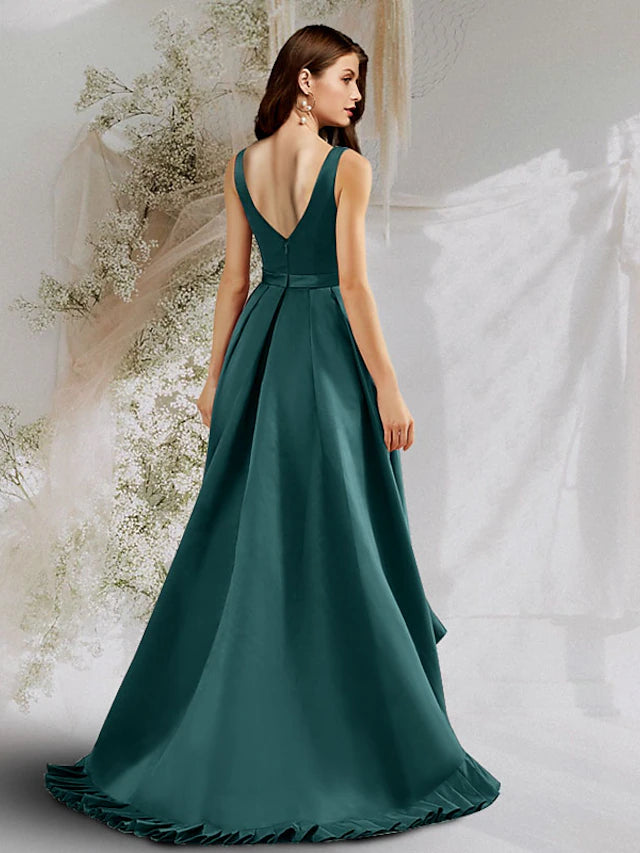 Close-up of A-line satin prom dress details, showing V-neck and ruffles.