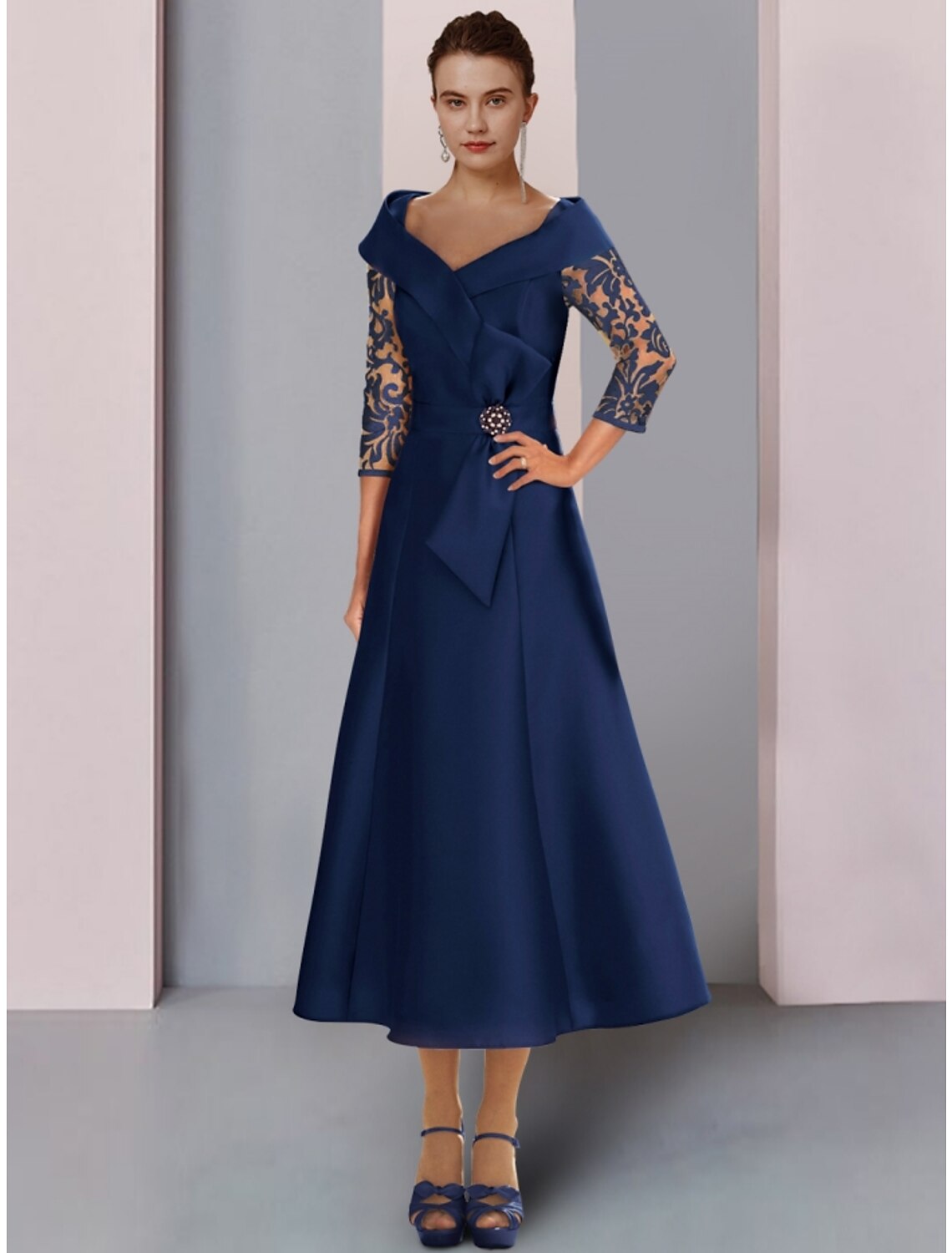 Elegant A-Line Mother of the Bride dress with V-neck and 3/4 sleeves.