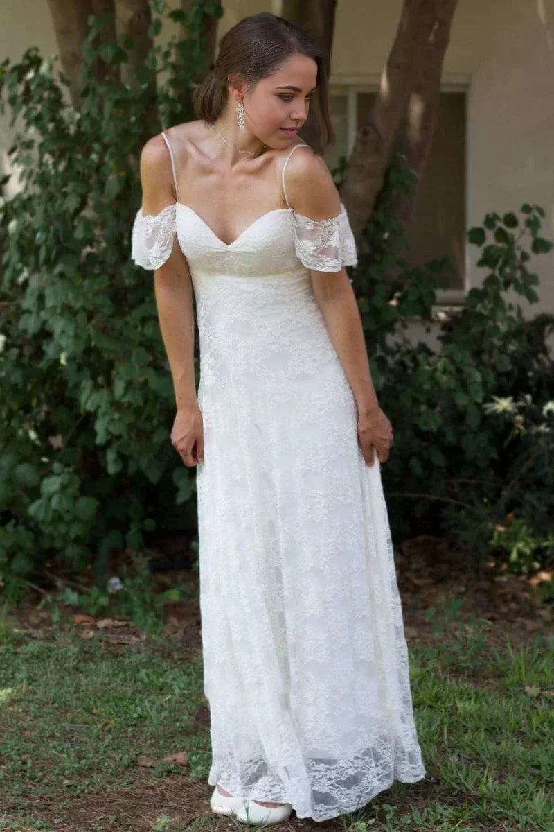 Elegant A-line wedding dress with spaghetti straps and off-the-shoulder lace details.