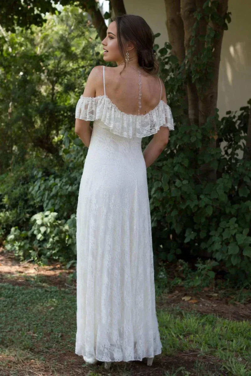 Back view of the lace floor-length wedding gown, showing intricate detailing.