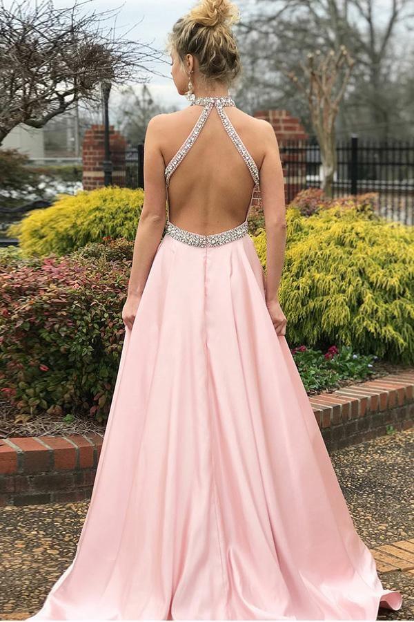 Close-up of the beaded V-neckline on the pink satin prom dress.