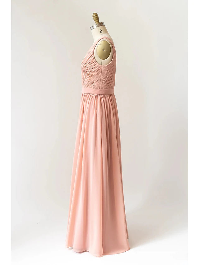 Detail of the chiffon fabric and pleats on the floor-length dress.