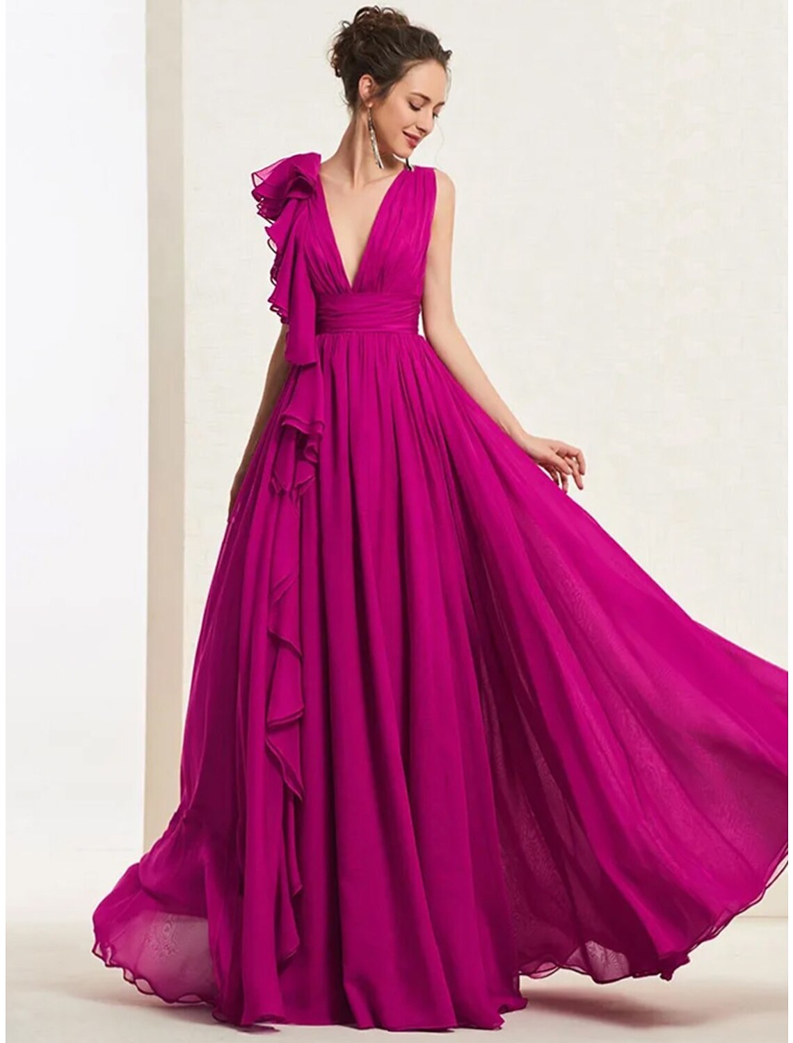 Elegant A-line V-neck gown with open back.