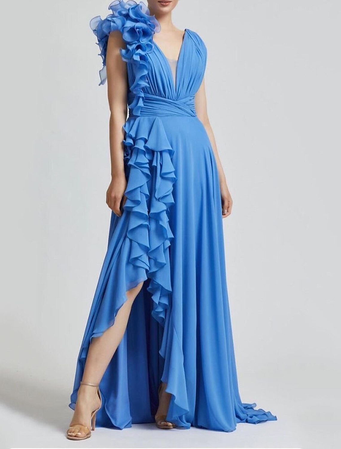 Side view of A-line V-neck gown with pleated details.