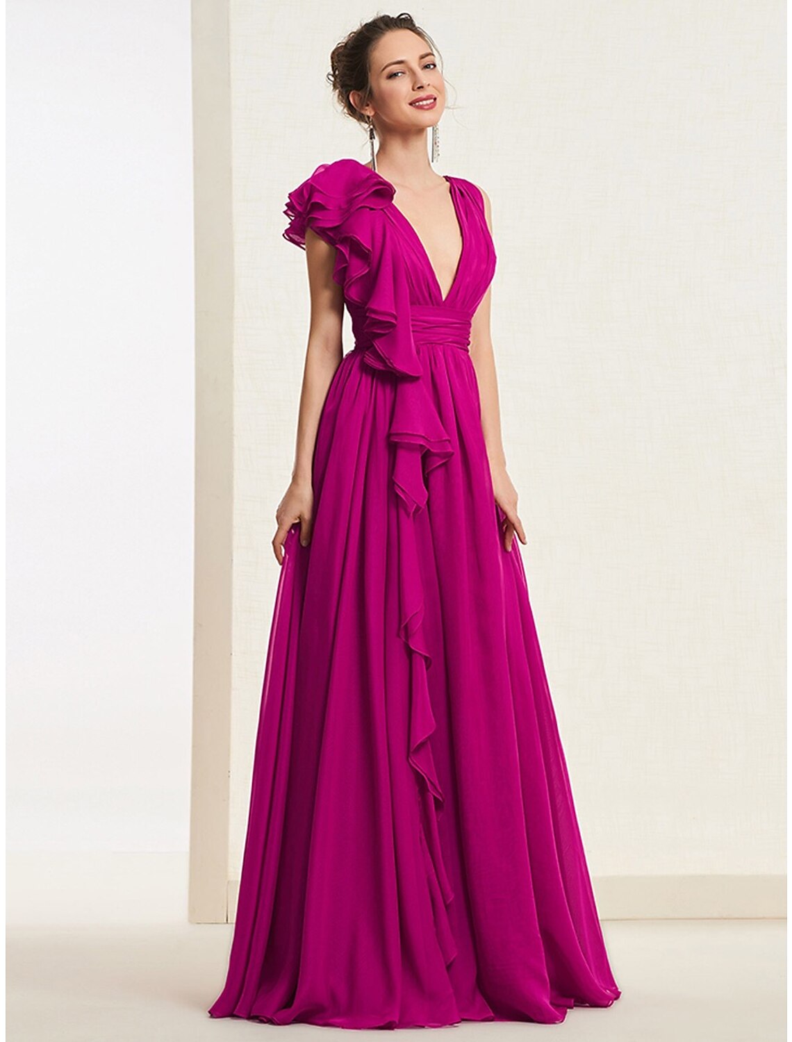 Full length view of A-line V-neck gown with flowing skirt.